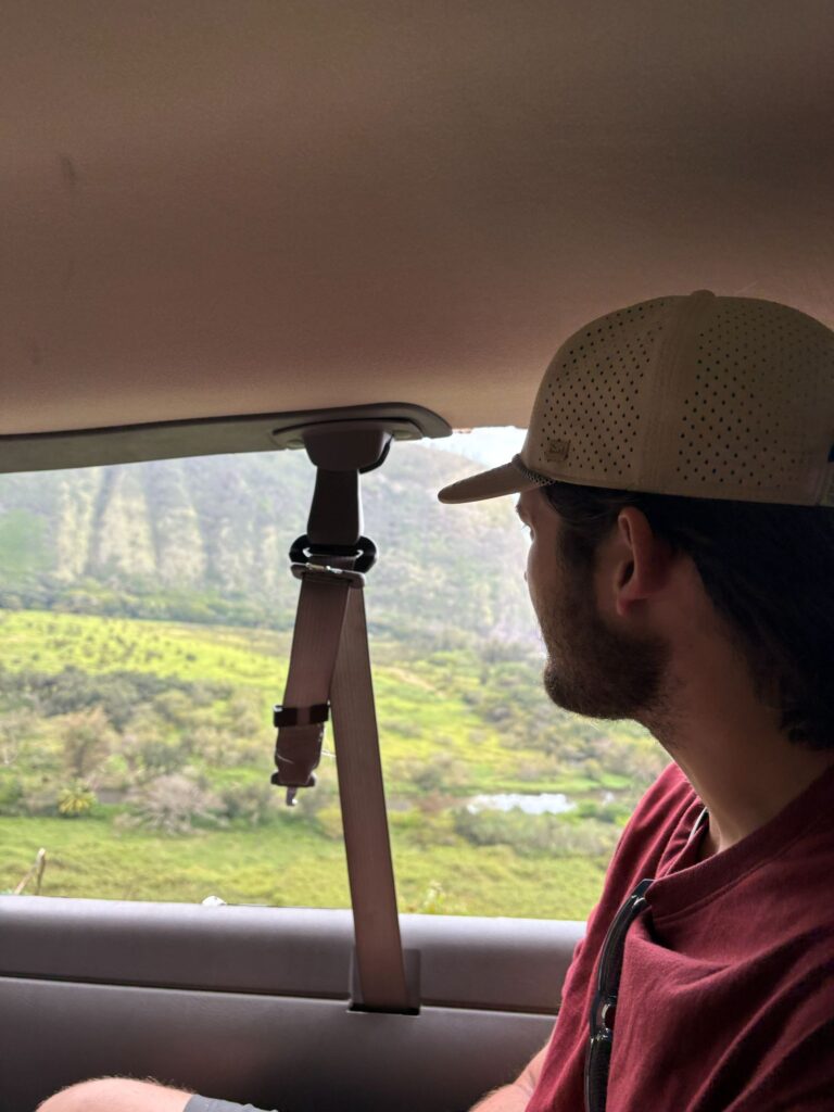 waipio valley tour man looking out window of van
